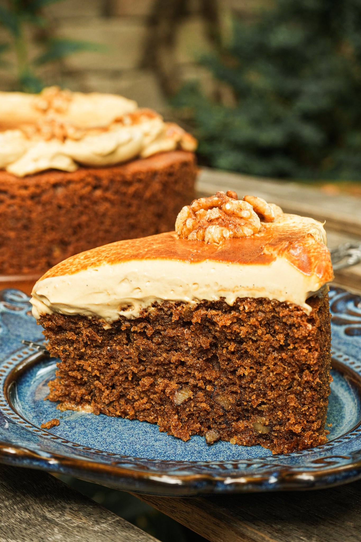 slice of a coffee walnut cake at a cafe in bangkok.