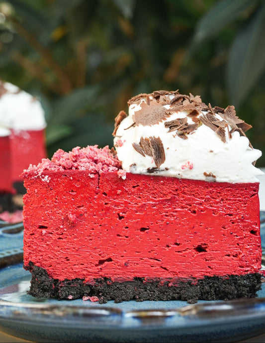 Red velvet cheesecake with whipped cream for valentine's day 2026.